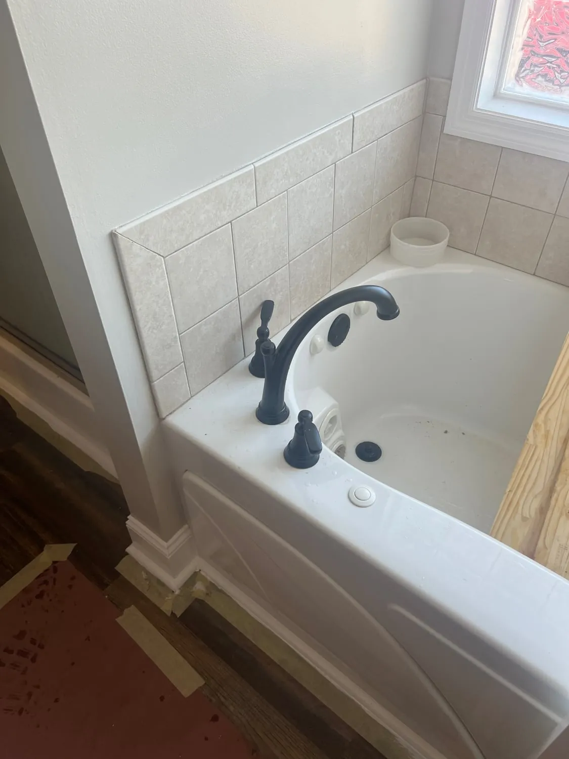 Oil-rubbed bronze faucet installed on a garden tub